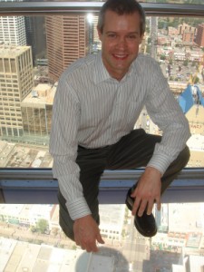 Standing on the glass floor 525 feet over the street at the Calgary Tower.